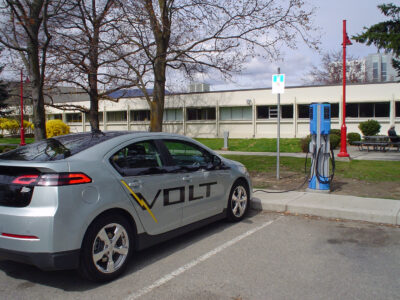 Chevrolet Volt stops at an EV charging station