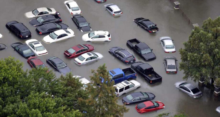 Flood-damaged cars flooding in
